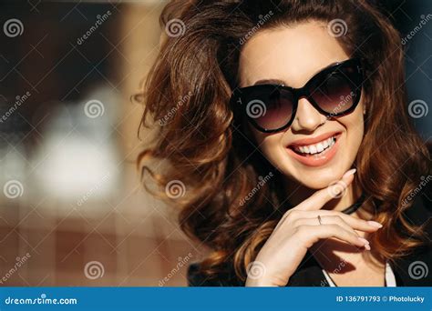 Smiling Beautiful Brunette In Sunglasses Happy Posing At Camera Stock