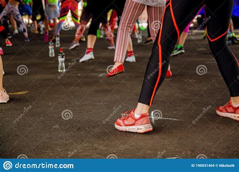 Large Group Of Fit And Active People Doing Exercise Outdoor Stock Photo