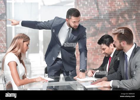 Strict Boss Talking To Employees At A Business Meeting Stock Photo Alamy