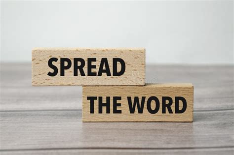 Spread The Word Text On Wooden Block And Light Background Stock Photo