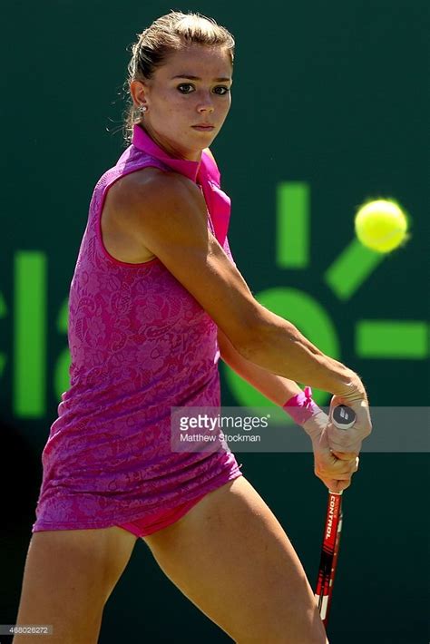 Camila Giorgi Of Italy Returns A Shot To Simona Halep Of Romania Tennis Players Female