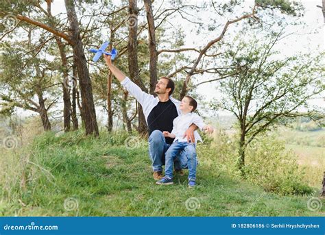 father and son have fun together in nature father and son playing people having fun outdoors