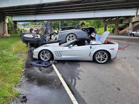 Driver Rescued After Car Falls Off Bridge And Lands On Another Car