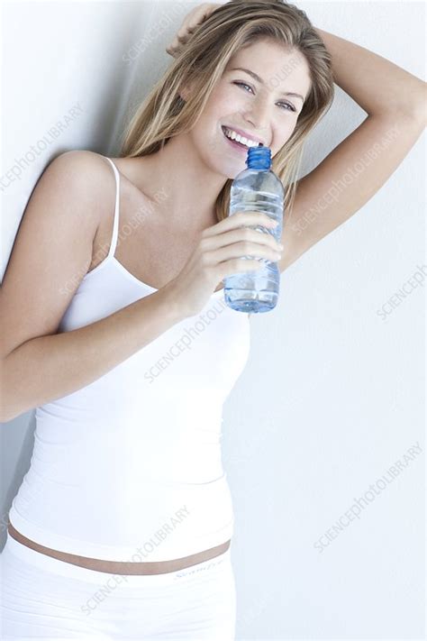 Woman Drinking Bottled Water Stock Image F Science Photo
