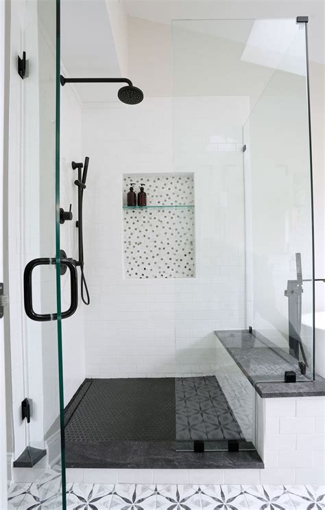 master bathroom remodel black matte fixtures grey black and white patterned tile white