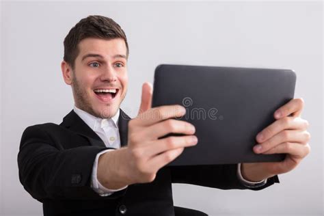 Happy Businessman Looking At Digital Tablet Stock Photo Image Of