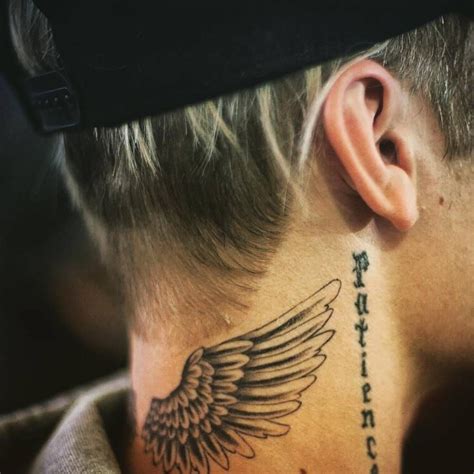 Justin Biebers Wings Tattoo On The Back Of His Neck Back Of Neck