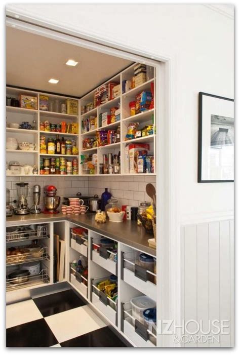 An Open Pantry With Lots Of Food In It