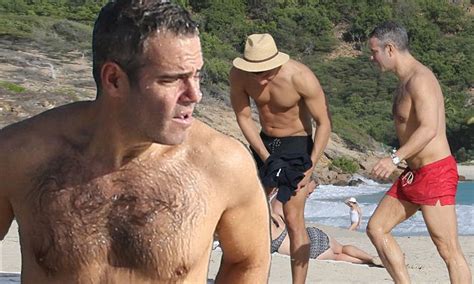 Andy Cohen Hits The Beach In Fire Red Trunks With Hunky Boyfriend