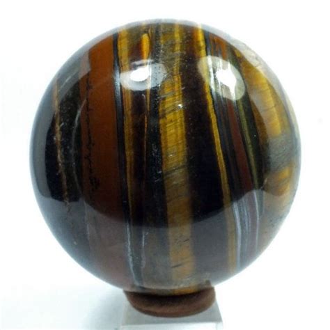 A Finely Polished Sphere Carved In Tiger Eye From Rough Etsy