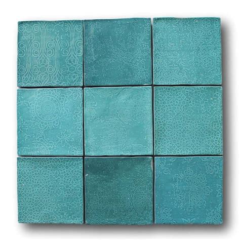 Several Square Tiles With Different Designs In Blue And Green Colors