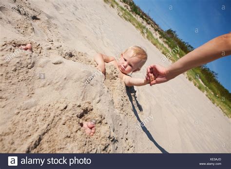 Young Girl Buried In Sand High Resolution Stock Photography And Images