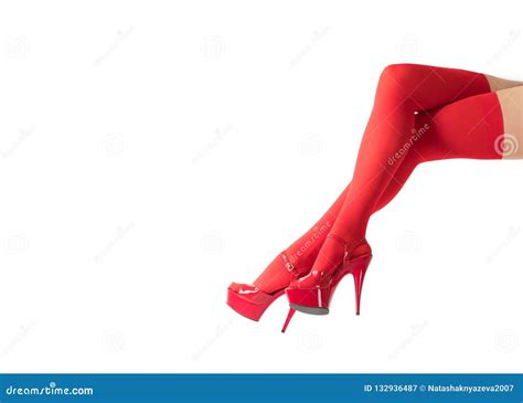 Female Legs In Fetish Red Stockings And Red High Heels Isolated On White Christmas And New