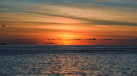 Download Wallpaper 1600x900 Sea Horizon Sunset Clouds Sky Ripples