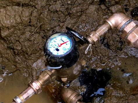 The meter has been installed but with the recent rain, is under water due to the hole that was dug. Leak Testing For A Water Line Leak Using A Water Meter