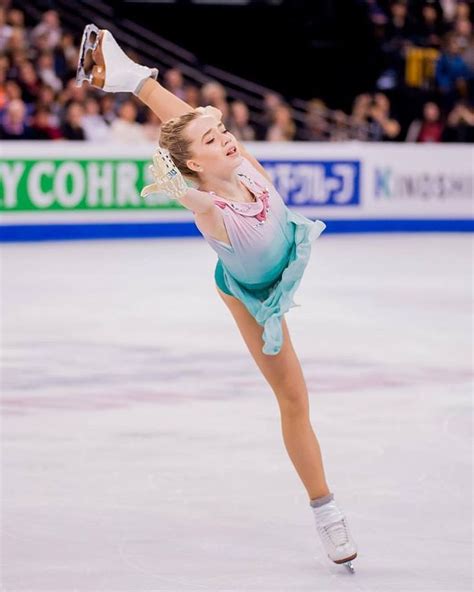 A Female Figure Skating On An Ice Rink