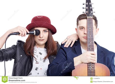 A Musical Duo Of A Young Couple A Singer In A Red Hat With A Mi Stock