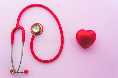Red Stethoscope And The Heart On Pink Background Stock Photo Image