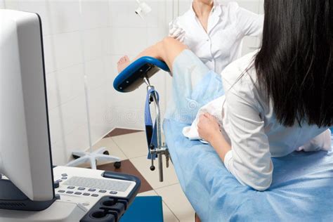 Cropped Panorama Of Gynecologist Examining A Patient Who Is Sitting In