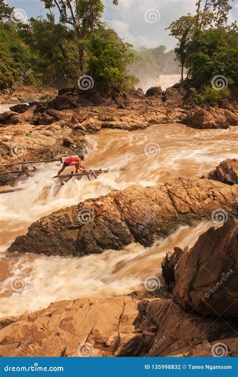 Laos Fisherman In Rapids Of Khone Phapheng Falls On The Mekong River