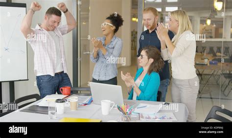 Cheerful Coworkers Celebrating Stock Photo Alamy