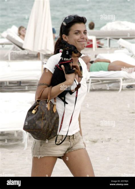 Elisabetta Canalis Relaxes With Her Pooch And Pals On The Beach In