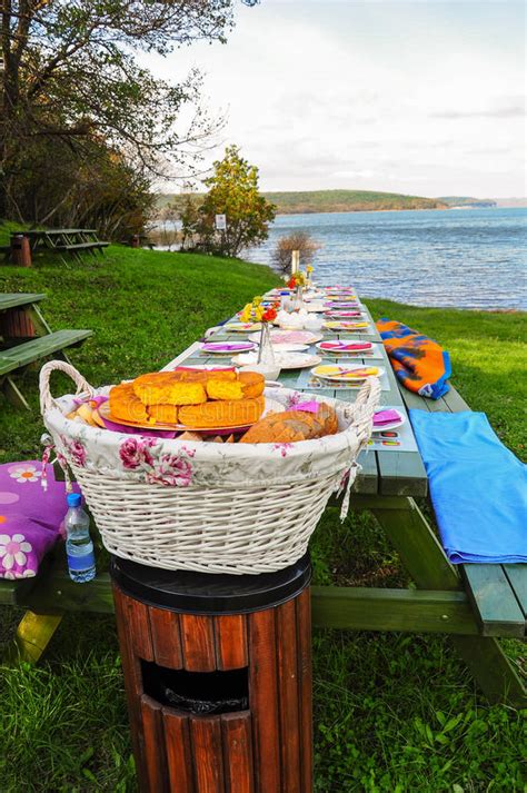 A Fancy Picnic Table Full Of Food By Lake In Spring Stock Image Image