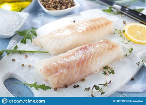 Fresh Fish Raw Cod Fillets With Addition Of Herbs And Lemon Stock