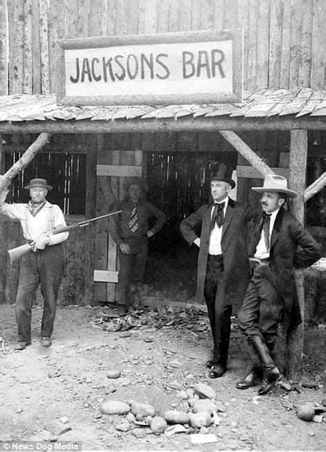 A Patron Cradles A Rifle Outside Jacksons Bar In Idaho Weapons Were A