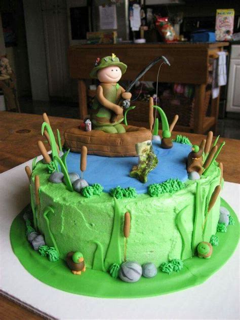 A Birthday Cake With A Man Fishing On The Lake And Golf In The Pond