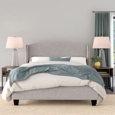 Finishing the look is a rubber wood frame, foam padding, and grid tufting. Beds | Joss & Main