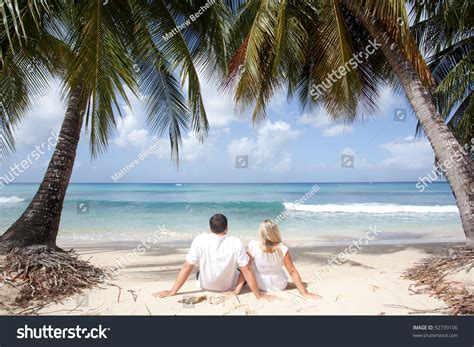 Couple Sitting Under Palm Trees Tropical Stock Photo 92739106