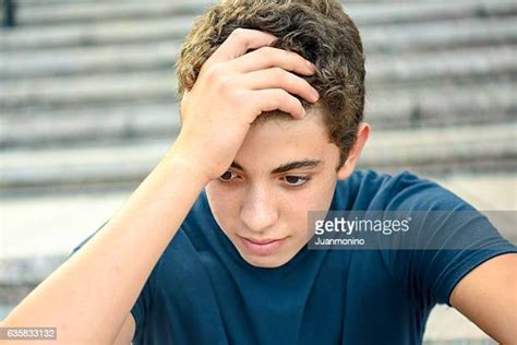 Teenage Boy Head In Hands Photos And Premium High Res Pictures Getty
