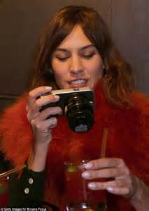 Alexa Chung Wraps Up Warm With Faux Fur Shawl As She Captures Lfw Footage On Her Camera Daily
