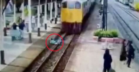 Man Throws Himself In Front Of Moving Train But Runs Away Seconds Later After Train Miraculously