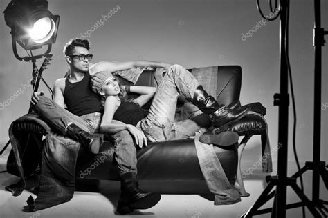 Sexy Man And Woman Dressed In Jeans Doing A Fashion Photo Shoot In A
