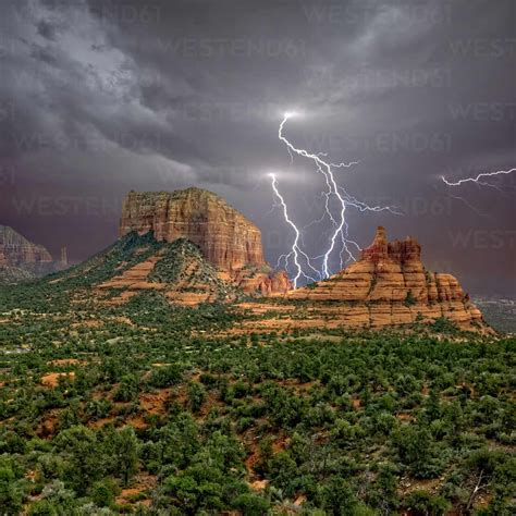 Lightning Striking In Between Courthouse Butte And Bell Rock Near