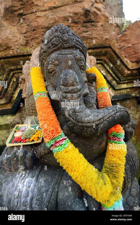 A Rock Carved Statue Of The Hindu Got Ganesh In A Temple In Ubud