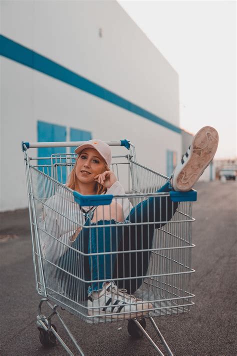 Hd Wallpaper Woman Sitting On Gray Stainless Steel Shopping Cart One Person Wallpaper Flare