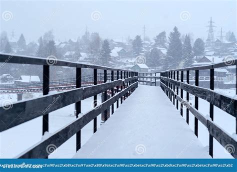Snow Covered Bridge Over The River In The Winter Countryside Stock