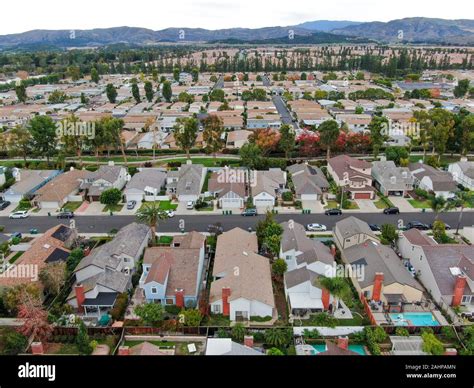Aerial View Of Urban Sprawl Suburban Packed Homes Neighborhood With
