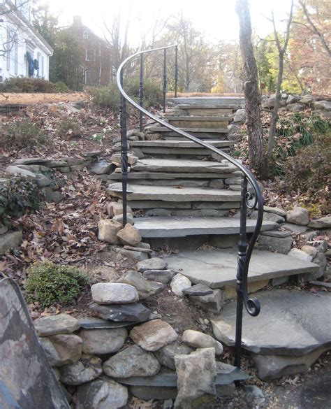 Decorative Garden Ironwork Railing On Stone Steps With Ornate Posts And