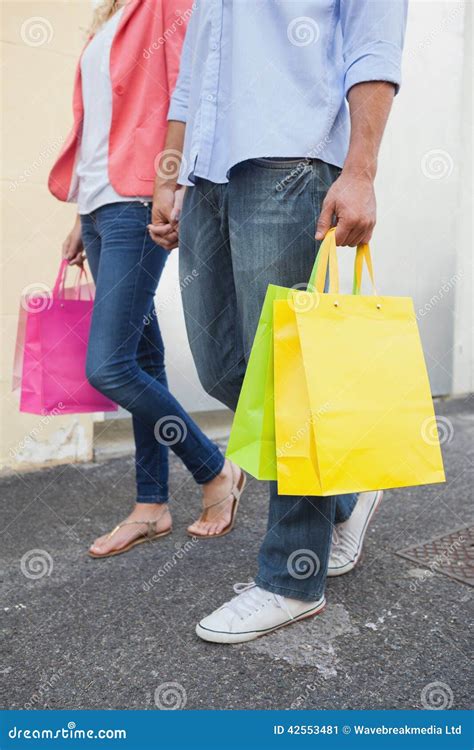 Stylish Young Couple Standing With Shopping Bags Stock Image Image Of