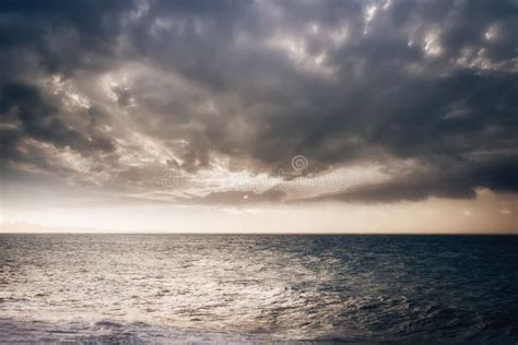 Stormy Ocean With Sunset Cloudy Sky Stock Image Image Of Coast
