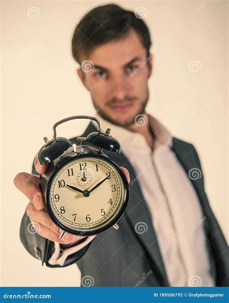 Businessman Holds An Alarm Clock In His Hands Stock Photo Image Of