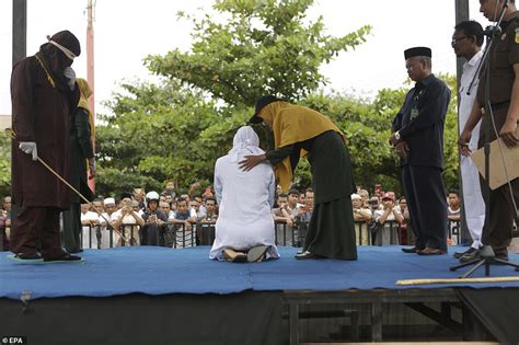 woman is caned in public for having sex outside wedlock in indonesia daily mail online