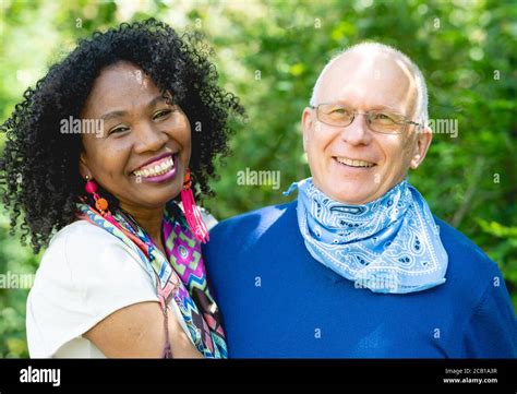 Portrait Of A Laughing Married Couple Dark Skinned Woman And Light