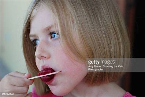 sucking popsicle photos and premium high res pictures getty images