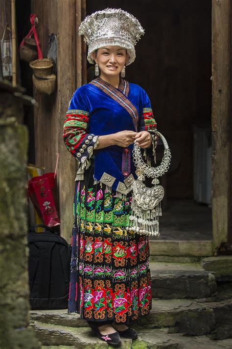 a-miao-lady-in-front-of-her-home-hmong-clothes,-miao-people