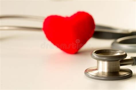 Health Care Concept Stethoscope Near Rubber Heart On White Background